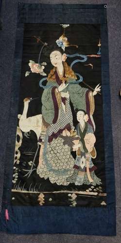 A large Chinese Qing dynasty embroidered silk panel depictin...