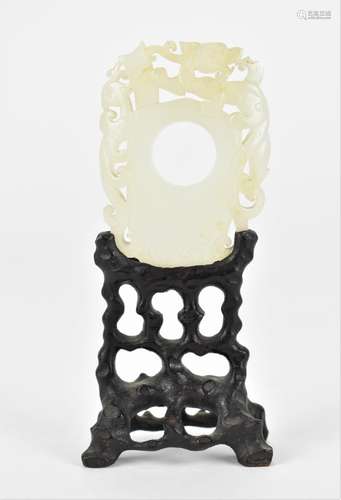 A Chinese carved and pierced white jade plaque on stand, des...