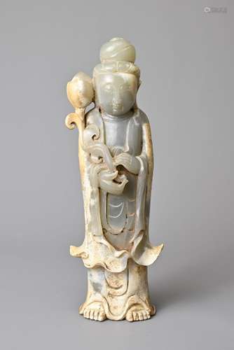 A CHINESE JADE FIGURE OF GUANYIN. The figure standing dresse...