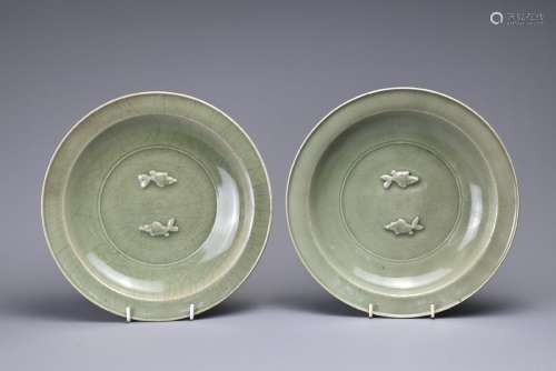 TWO CHINESE LONGQUAN CELADON 'TWIN FISH' DISHES. Each thickl...