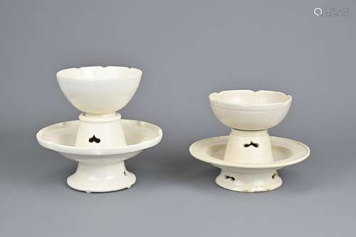 TWO CHINESE WHITE GLAZED FOLIATE PORCELAIN CUPS AND STANDS. ...