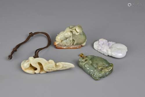 A GROUP OF FOUR CHINESE JADE ITEMS. To include a pale celado...