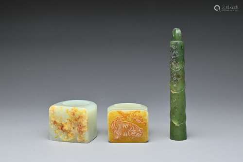 TWO CHINESE CARVED JADE RINGS AND A SPINACH JADE PENDANT. Co...