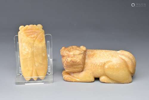 A CHINESE CARVED JADE CICADA AND A DOG. Each of mottled pale...