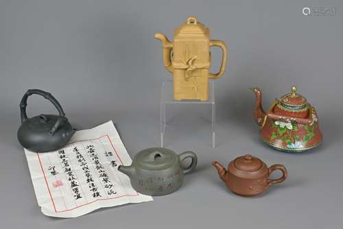 A GROUP OF FIVE YIXING POTTERY AND CLOISONNE TEAPOTS, 20TH C...