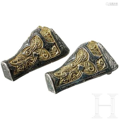 A pair of Viking silver fibulae with gilding in the shape of...