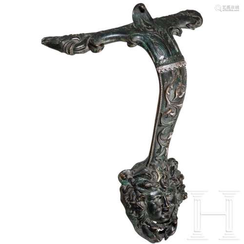 A richly decorated bronze handle based on Roman models, Rena...