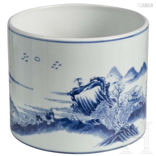 A large Chinese blue and white brush pot with mountain and r...