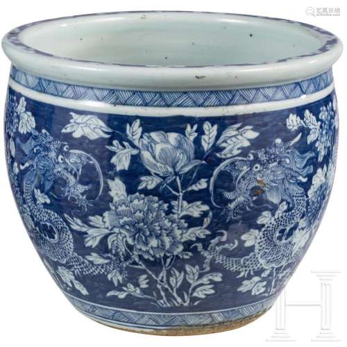 A large blue and white porcelain jardiniere with dragons, pr...
