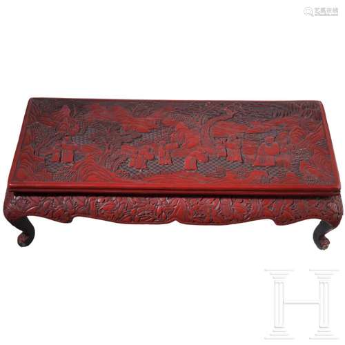 A small Chinese red lacquer table, circa 1900