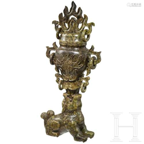 A Chinese jade foo dog with vase, 20th century