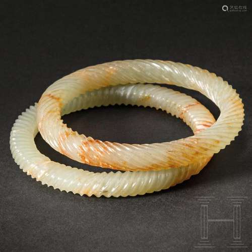 A pair of Chinese celadon jade bangles, 20th century