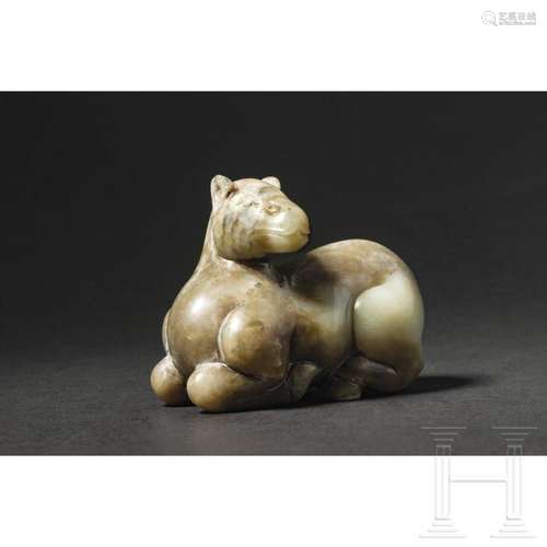 A Chinese jade figure of a recumbent lamb, 20th century