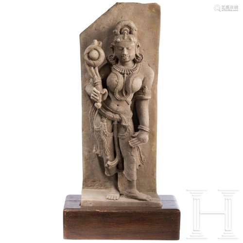 An Indian sandstone figure of a female deity (Dewi Sri?), pr...