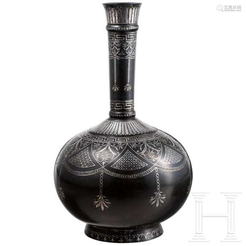 A silver-inlaid Indian bidri bottle, circa 1800