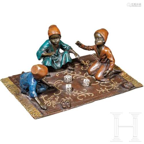 Three playing children on a carpet, Vienna bronze, circa 190...