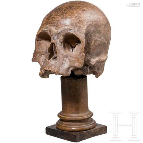 An Italian terracotta memento mori skull, 17th/18th century