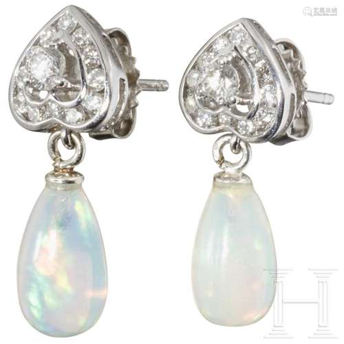 A pair of elegant 18ct gold and opal earrings