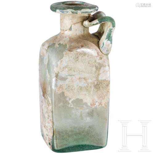 A Roman glass bottle, 2nd century A.D.