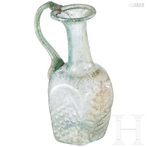 A Roman glass bottle, 3rd century