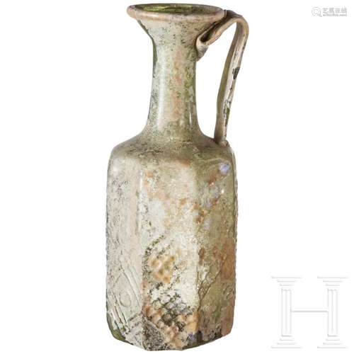 A large Roman glass bottle, 3rd/4th century