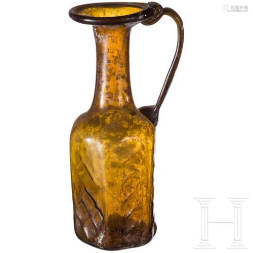 A Roman glass bottle, 3rd century