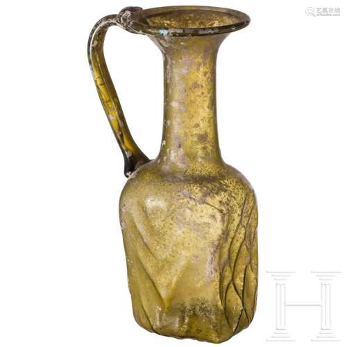 A Roman glass bottle, 3rd century