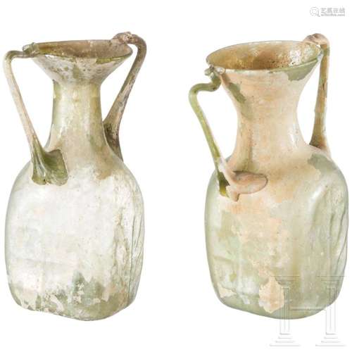 Two Roman double-handle glass bottles, 3rd century