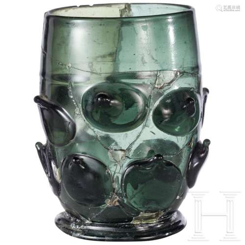 A German prunted glass beaker, early 16th century