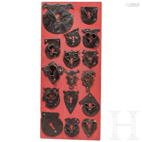 A collection of 16 iron key plates, 15th/16th century