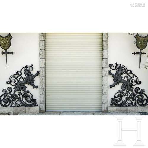 A pair of German forged iron ornamental grilles showing lion...