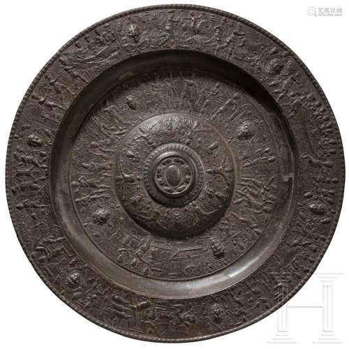 A French relief pewter dish by a master working in the ambit...