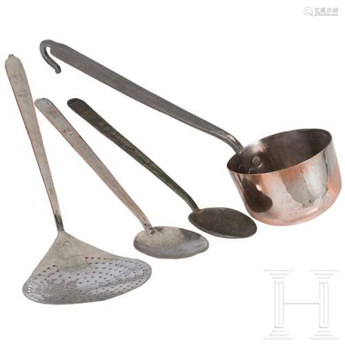 A ladle, a foam strainer and two large spoons made of copper...