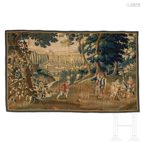 A large Flemish tapestry depicting a genre scene with bowlin...