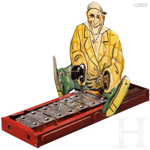 A tin toy "Grock the Clown" playing xylophone, DRG...