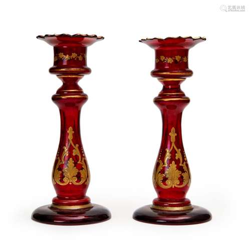 A PAIR OF CRANBERRY BOHEMIAN CANDLESTICKS, 19TH CENTURY