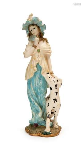 A PORCELAIN FIGURINE OF A LADY & A DOG