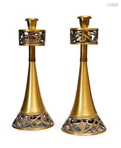 A PAIR OF BRASS CANDLESTICKS