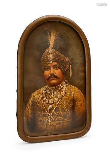 A FRAMED PAINTING OF A MAHARAJA