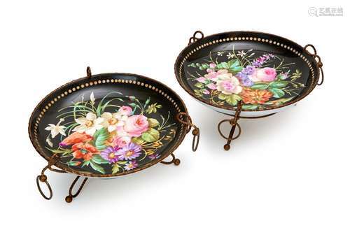 A PAIR OF FLORAL PORCELAIN PLATES ON FRENCH MOUNTS, PROBABLY...