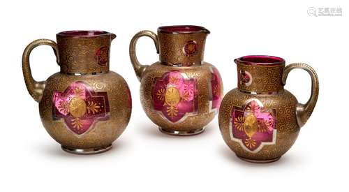 THREE GILT CRANBERRY BOHEMIAN JUGS, 19TH/20TH CENTURY