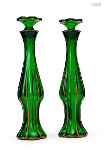 A PAIR OF GREEN GLASS SCENT BOTTLES WITH STOPPERS, 19TH/20TH...