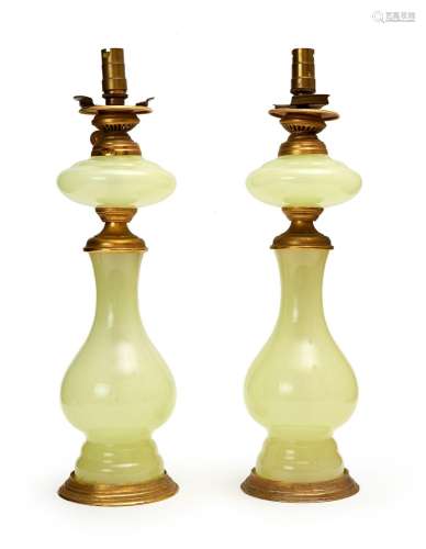 A PAIR OF GLASS OIL LAMPS