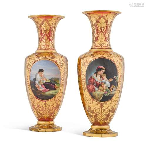 A PAIR OF RUBY GROUND BOHEMAIN GILT DECORATED MEDALLION VASE...