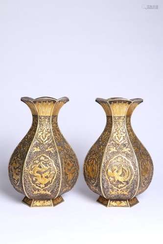 A pair of cupronickel partial gilt dragon and phoenix Chengx...