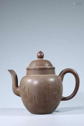 Purple clay teapot with carved bamboo poems