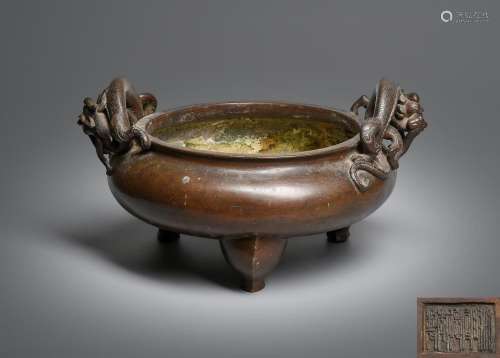 A Large Chinese bronze \'Dragon\' tripod censer