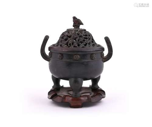 A large Chinese two-handled tripod censer