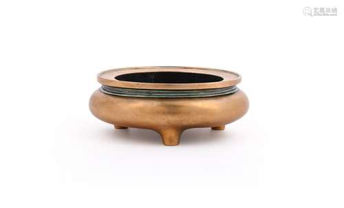 A Chinese bronze tripod censer