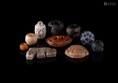 An interesting group of four inlaid glass \'eye\' beads